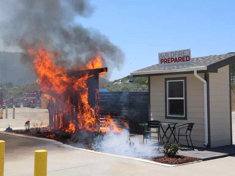 A side-by-side demonstration showing the effectiveness of research-based wildfire mitigation actions, including maintaining a noncombustible five foot buffer around a home to help reduce its risk of ignition, held in California on May 7, 2024. 

Embers–the leading cause of home ignitions during a wildfire–attacked and eventually burned the unmitigated structure while the mitigated building did not ignite.

The demonstration was conducted by the Insurance Institute for Business & Home Safety (IBHS) in co