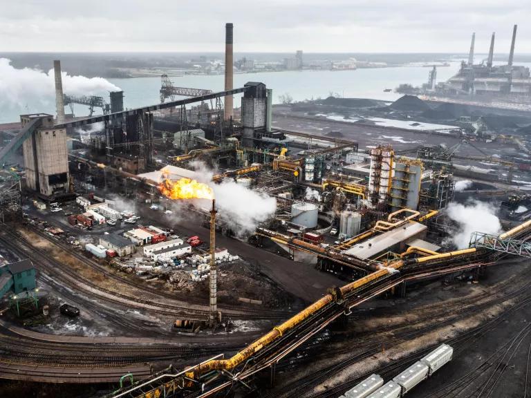 Emissions rising from the EES Coke Battery facility on Zug Island in River Rouge, Michigan.

Zug Island is located where the mouth of the River Rouge spills into the Detroit River.