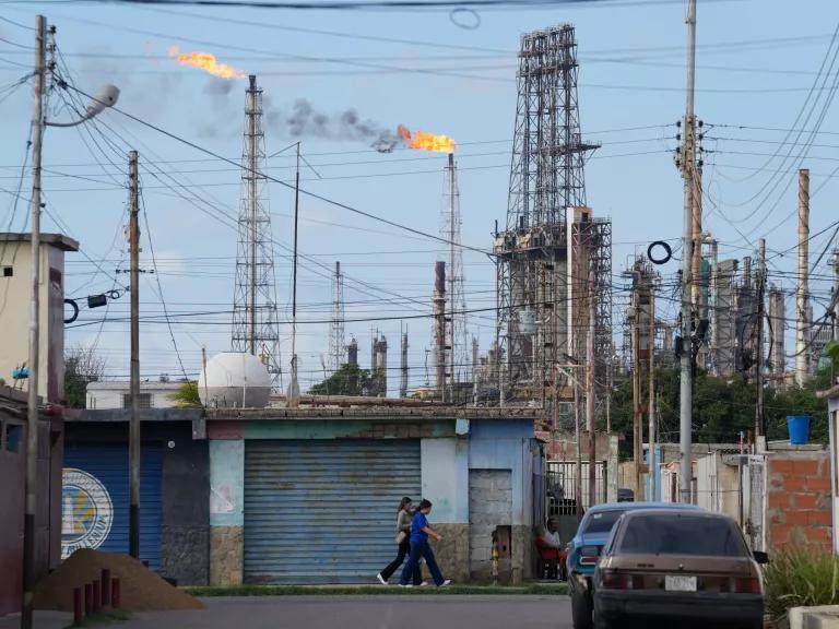 Flames rise from flare stacks at the Amuay Refinery in Los Taques, Venezuela, on January 14, 2026.