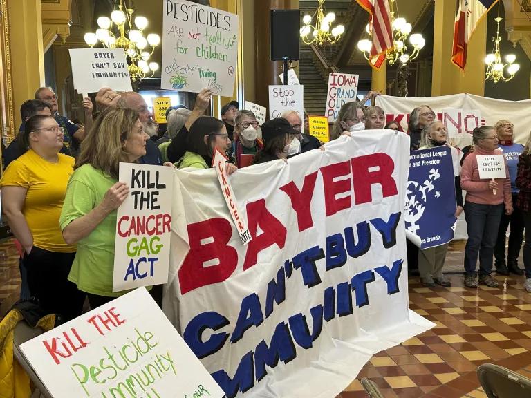 Protesters rally against an Iowa Senate bill, proposed by Bayer, that would shield pesticide companies from cancer-related lawsuits, at the Iowa state capitol in Des Moines on February 10, 2025.