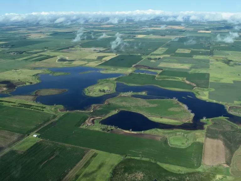 Prairie potholes amid farm fields in South Dakota.