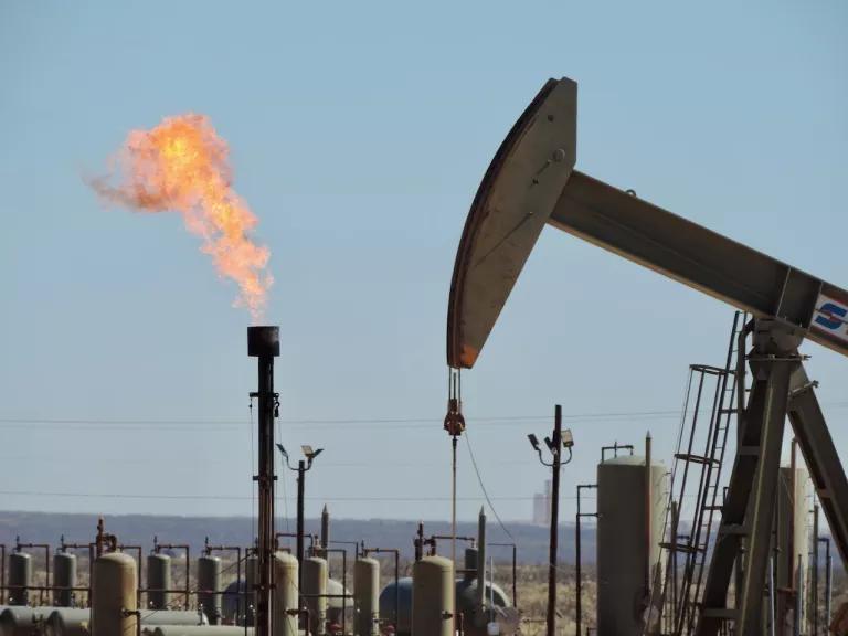 A methane flare at an oil and gas extraction site in the Permian Basin, New Mexico.