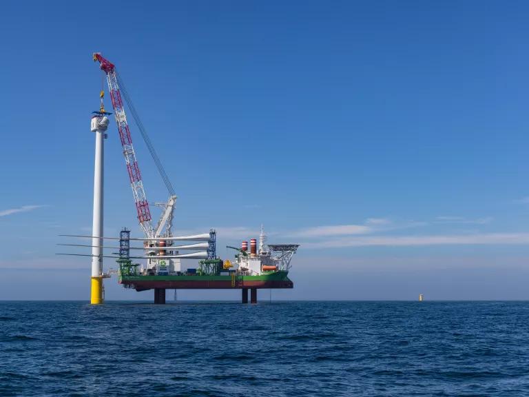 An offshore wind turbine tower and nacelle under construction at the Vineyard Wind site off the coast of Massachusetts on October 6, 2023.

Vineyard Wind is the first utility-scale offshore wind energy project in the U.S. and sits over 15 miles off the coast. The project expects to generate clean, renewable, affordable energy for over 400,000 homes and businesses across the state.