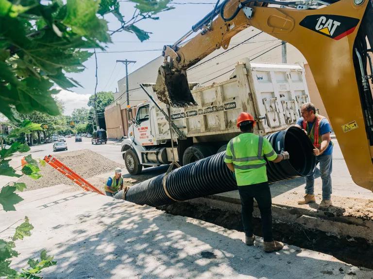 Public Works crew members replacing a sewer pipe in Mount Vernon, New York.
