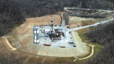 An aerial view of a gas pipeline construction site and fracking rig in Marshall, West Virginia