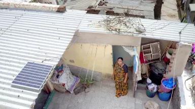 An aerial view of Laxmiben Chavda at her home in Rajivnagar III, Ahmedabad, India, which has a bamboo roof purchased via a loan from Mahila Housing Trust