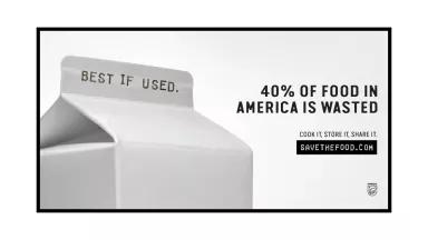 Advertisement from SaveTheFood.com shows a carton of milk stamped with the words "BEST IF USED." alongside a statistic "40% of Food in America Is Wasted." The catchphrase is Cook It. Store It. Share It. above a box with the campaign name SavetheFood.com and a logo for NRDC
