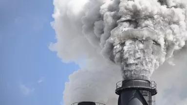Smoke stacks emitting thick smoke