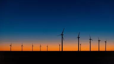 The sun sets behind the T-bone Wind and Ribeye Wind farms near Dumas, Texas.