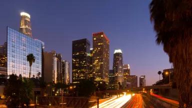 Los Angeles downtown at dusk, with the 110 freeway in the foreground Los Angeles downtown at dusk