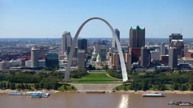 The Gateway Arch stretching over the State Capitol building in Jefferson City, St. Louis, Missouri.