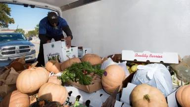 A DC Central Kitchen driver loading a truck with unsold produce and baked goods gleaned from the USDA Farmers Market in Washington, DC, on October 27, 2017.

DC Central Kitchen is a community kitchen that recycles food from around Washington, DC, and uses it as a tool to train unemployed adults to develop work skills while providing thousands of meals for local service agencies.
