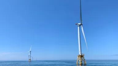 wind turbines on blue waters