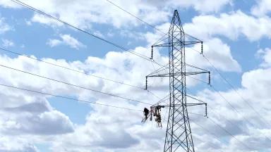 Workers repairing high voltage power lines in Lincoln, Nebraska