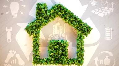 An illustration showing the outline of a house in green leaves with sustainability symbols in the background