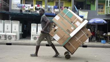 A man pulls new air conditioners on the street in Lagos, Nigeria, on July 15, 2024.