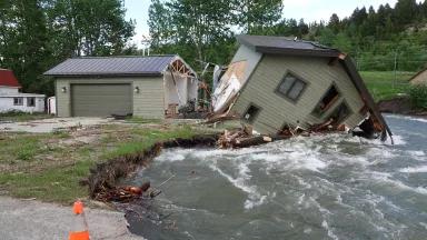 A home collapsed into a flooded Rock Creek on 9th St. in Red Lodge, Carbon County, Montana, on June 17, 2022.