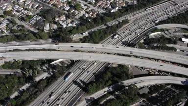 Traffic crossing a freeway interchange near a residential neighborhood in Los Angeles, California.