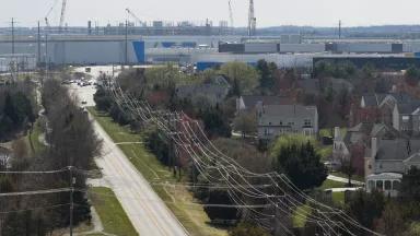 Power lines connect to a data center beside a residential neighborhood in Ashburn, Virginia, on March 12, 2026.

Data centers require large amounts of natural resources, including water, to run. Northern Virginia has the largest concentration of data centers in the world, managing roughly 70% of global internet traffic.