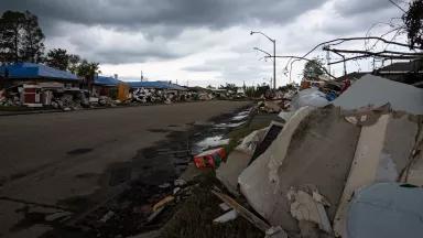 A street lined with piles of debris following Hurricane Ida in LaPlace, St. John the Baptist Parish, Louisiana, on October 1, 2021.
