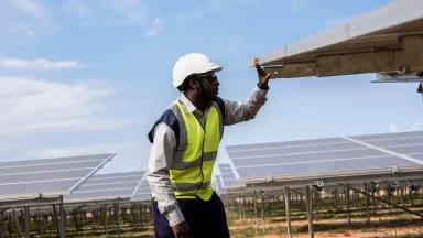Ambrose Kamukama, an Operations and Maintenance Engineer from Access Uganda Solar Ltd., works at Soroti Power plant in Soroti District, Uganda, on December 12, 2016. 

Residents of the town, surrounded by thatched huts, rivers and grasslands, hope a new solar plant, which went into operation last week, will bring an end to their electricity woes. 

The 33-acre solar plant–the first of its kind in East Africa–can produce 10 megawatts of power that is fed into Uganda's national power grid. The project is 