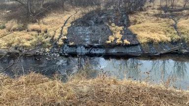 Crude oil spilling into Mill Creek after a pipeline rupture northeast of Washington, Kansas, in December 2022.

The TC Energy pipeline, part of the Keystone pipeline system, ruptured south of where it crosses Mill Creek on December 7, spilling an estimated 588,000 gallons.