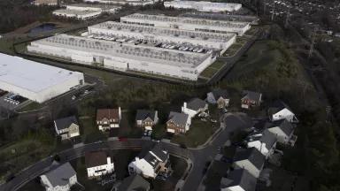 Amazon data center located beside a residential neighborhood in Sterling, VA on March 14, 2026. Data centers require large amounts of natural resources, including water, to run. Northern Virginia has the largest concentration of data centers in the world, managing roughly 70% of global internet traffic.