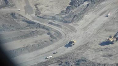 Aerial tar sands mine and trucks credit David Hawkins.JPG