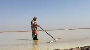 A salt-pan worker in the Little Rann of Kutch in Gujarat, India. 