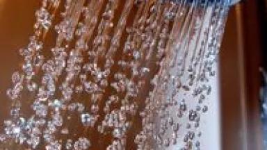 Shower Head with Droplets Close Up.jpg