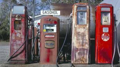A row of early 20th century gas pumps