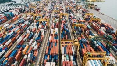 An aerial view of a busy container terminal or container yard.