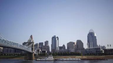 Cincinnati's skyline with bridge and river on a bluesky day