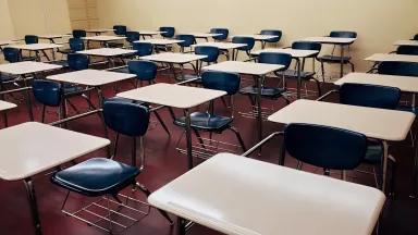 Empty desks in a classroom. 