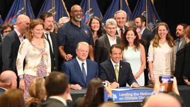 NY Governor Andrew Cuomo, pictured with Former Vice President Al Gore, at the signing for the CLCPA