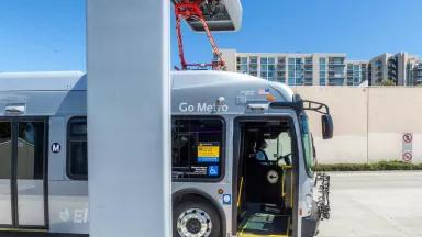An electric bus recharges at the Metro Orange Line Busway in Los Angeles County, California.