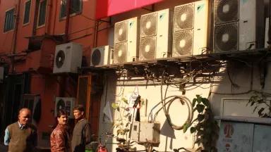 Building facades with rows of air conditioners in India. 