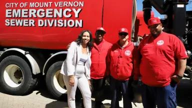 City Staff Stand In Front of A Mount Vernon Emergency Sewer Division Truck