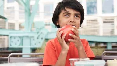 Child eating fruit, chlorpyrifos