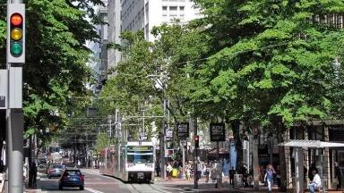 Portland's transit mall with cars, buses, and people walking