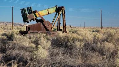 A rusty pumpjack at an abandoned oil well in the southern San Joaquin Valley, Maricopa County, California.