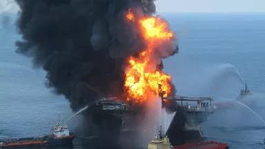 Oil supply boats use water cannons to fight fire and smoke rising from BP's mobile offshore drilling unit called Deepwater Horizon following an explosion on the rig in the Gulf of Mexico. 
